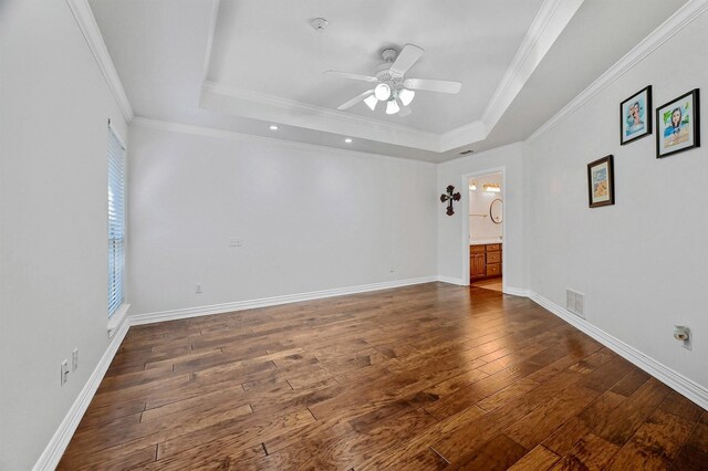 118 Hacienda Dr, Pottsboro, TX 75076 - empty room with a tray ceiling, a ceiling fan, dark wood finished floors, baseboards, and ornamental molding