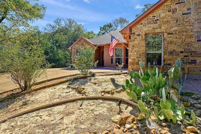 118 Hacienda Dr, Pottsboro, TX 75076 - view of front of property with stone siding and roof with shingles