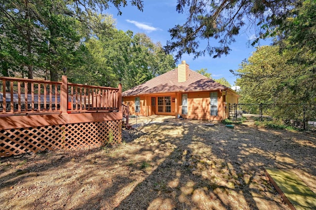 118 Hacienda Dr, Pottsboro, TX 75076 - rear view of house with fence, a deck, and a chimney