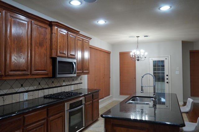 1136 Philip Dr, Allen, TX 75013 - kitchen featuring stainless steel appliances, a sink, baseboards, backsplash, and recessed lighting