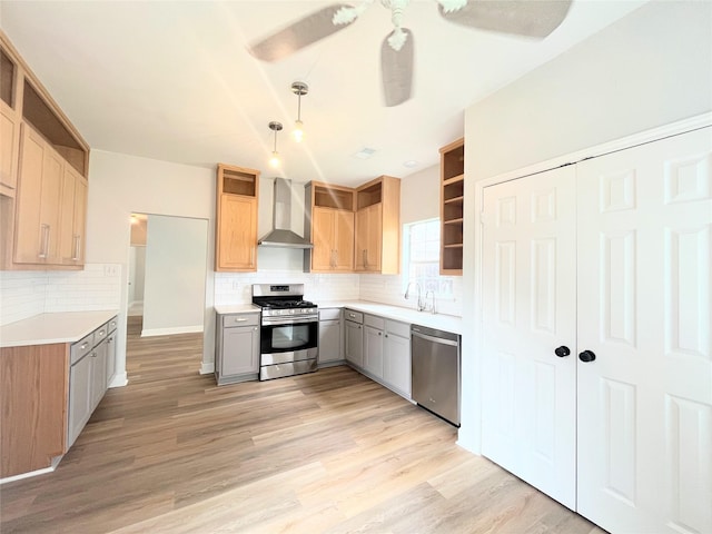 922 Mustang Dr, Allen, TX 75002 - kitchen featuring appliances with stainless steel finishes, wall chimney range hood, open shelves, tasteful backsplash, and light wood finished floors