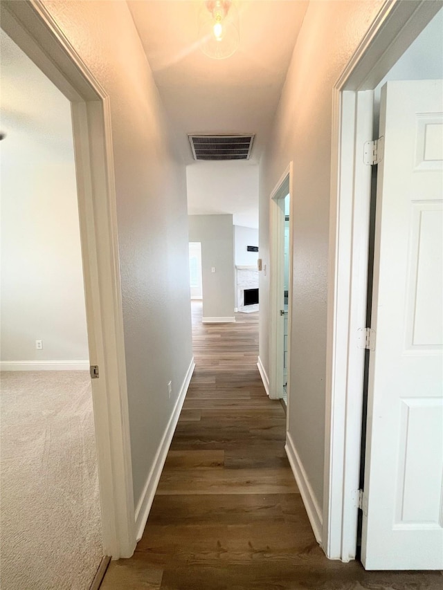 922 Mustang Dr, Allen, TX 75002 - hallway with dark wood-type flooring and baseboards