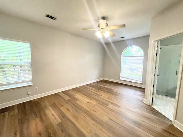 922 Mustang Dr, Allen, TX 75002 - empty room with a ceiling fan, wood finished floors, and baseboards