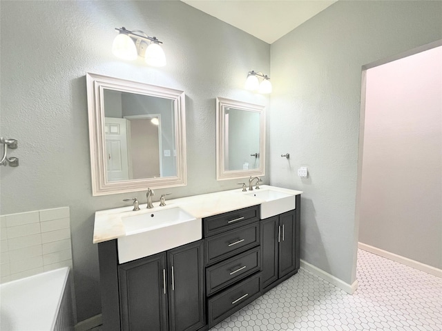 922 Mustang Dr, Allen, TX 75002 - bathroom with a bathtub, double vanity, and baseboards