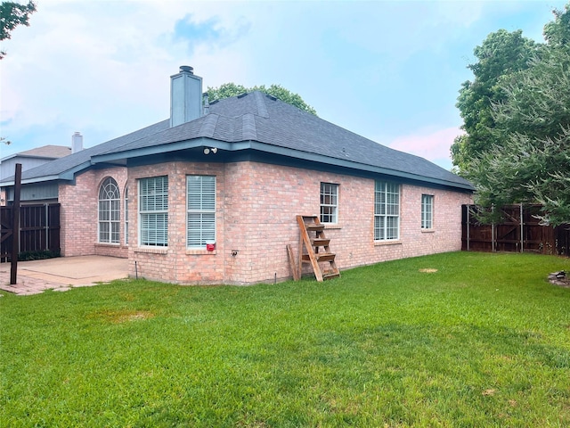 922 Mustang Dr, Allen, TX 75002 - back of property featuring a patio, brick siding, a chimney, and a shingled roof