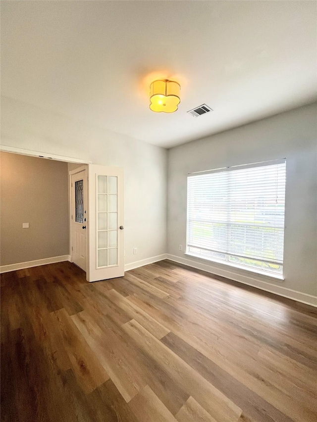 922 Mustang Dr, Allen, TX 75002 - spare room with wood finished floors and baseboards
