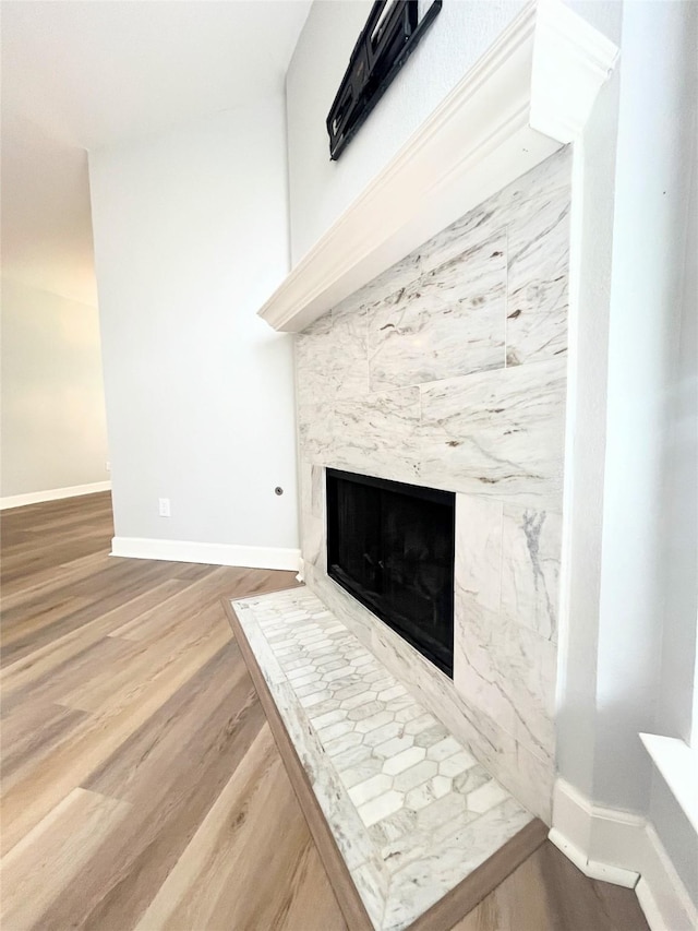 922 Mustang Dr, Allen, TX 75002 - detailed view of wood finished floors, a fireplace, and baseboards