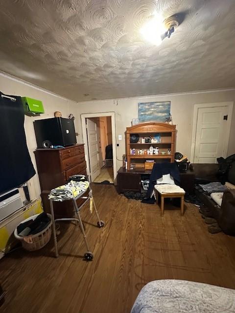 1505 S Austin St, Sherman, TX 75090 - bedroom with wood finished floors and a textured ceiling