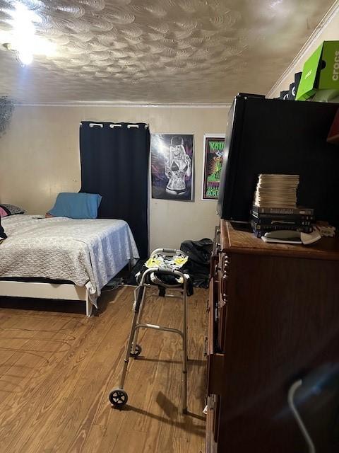 1505 S Austin St, Sherman, TX 75090 - bedroom with wood finished floors