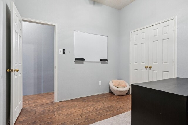5729 Brazos Dr, Haltom City, TX 76137 - hallway with wood finished floors