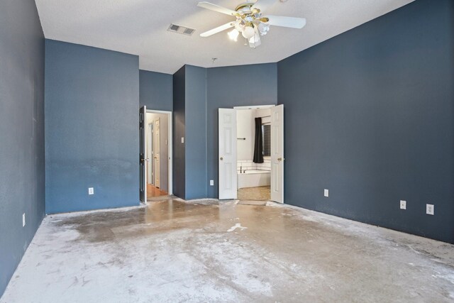 5729 Brazos Dr, Haltom City, TX 76137 - unfurnished bedroom with concrete flooring, connected bathroom, and ceiling fan