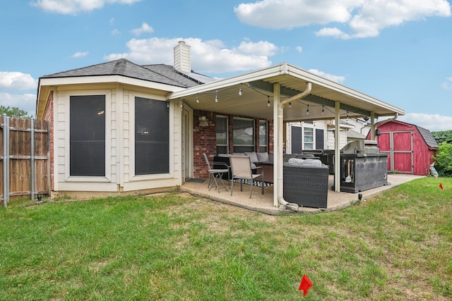 5729 Brazos Dr, Haltom City, TX 76137 - back of property featuring a storage shed, a patio area, an outdoor structure, brick siding, and a chimney