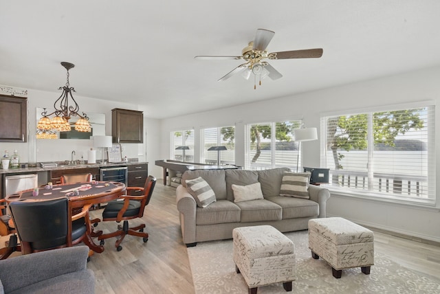 306 Chism Trl, Gordon, TX 76453 - living area featuring ceiling fan, light wood-style floors, and wine cooler