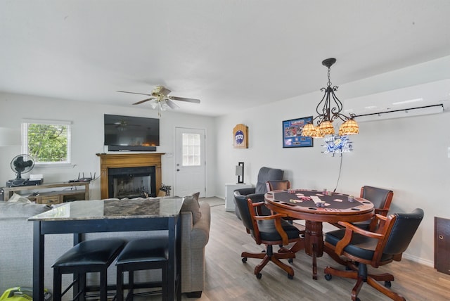 306 Chism Trl, Gordon, TX 76453 - dining space featuring plenty of natural light, a fireplace, and wood finished floors