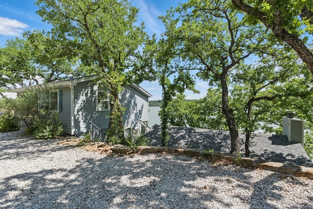 306 Chism Trl, Gordon, TX 76453 - view of side of home with a chimney
