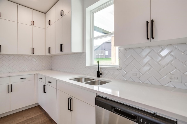 171 Tryall Ct, Runaway Bay, TX 76426 - kitchen with stainless steel dishwasher, a sink, decorative backsplash, and white cabinets