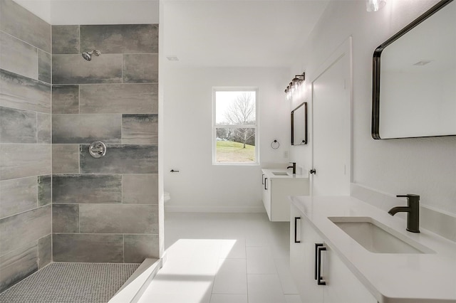 171 Tryall Ct, Runaway Bay, TX 76426 - bathroom featuring tile patterned floors, tiled shower, and two vanities