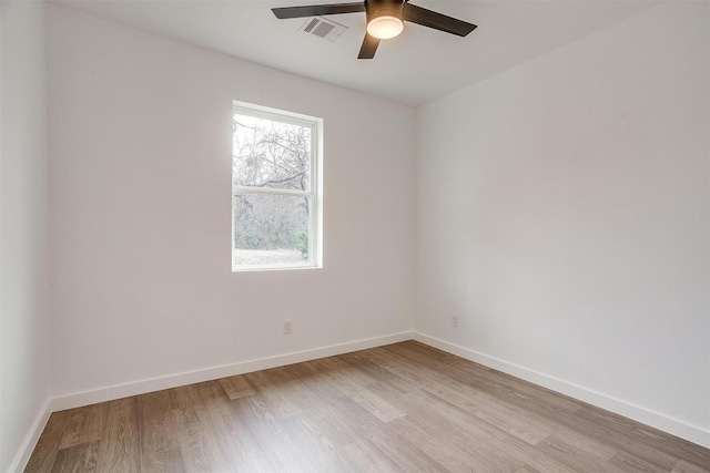 171 Tryall Ct, Runaway Bay, TX 76426 - spare room with light wood finished floors, a ceiling fan, and baseboards