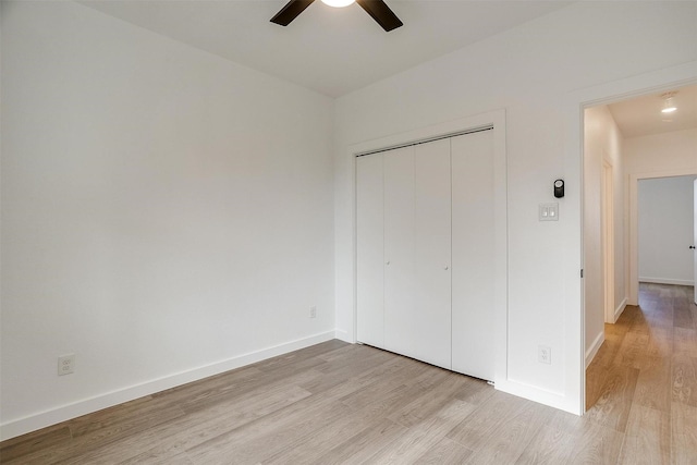171 Tryall Ct, Runaway Bay, TX 76426 - unfurnished bedroom featuring light wood finished floors, baseboards, a closet, and a ceiling fan