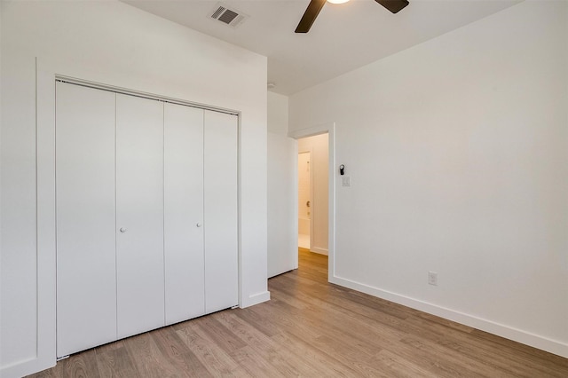 171 Tryall Ct, Runaway Bay, TX 76426 - unfurnished bedroom featuring light wood-style floors, a closet, baseboards, and a ceiling fan