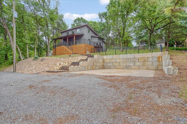 142 Wales Dr, Pottsboro, TX 75076 - view of home's exterior featuring stairway and fence