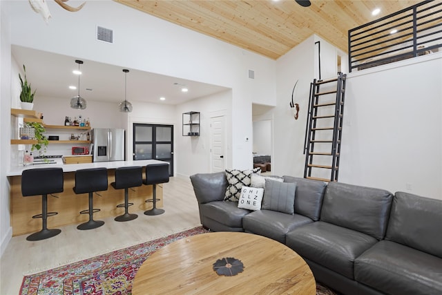 142 Wales Dr, Pottsboro, TX 75076 - living room featuring wood ceiling, high vaulted ceiling, light wood-style flooring, bar with sink, and recessed lighting