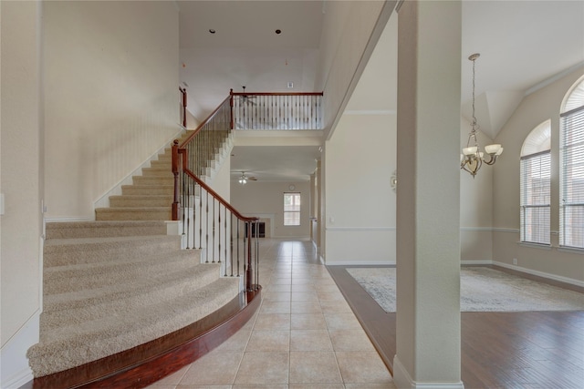 319 Paloverde Ln, Frisco, TX 75036 - staircase with a towering ceiling, a chandelier, and baseboards