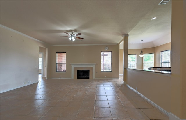 319 Paloverde Ln, Frisco, TX 75036 - unfurnished living room with ceiling fan, baseboards, light tile patterned flooring, a fireplace, and crown molding