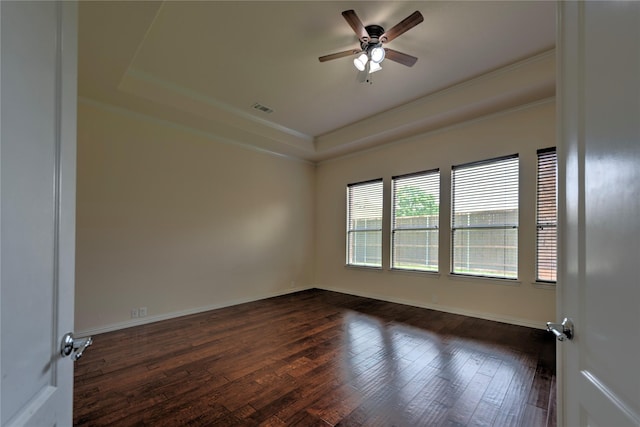 319 Paloverde Ln, Frisco, TX 75036 - empty room with a tray ceiling, dark wood finished floors, ceiling fan, crown molding, and baseboards