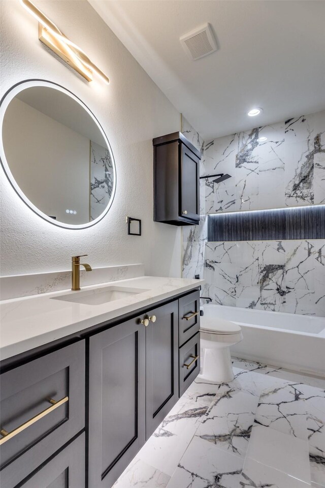 2614 Ave G, Fort Worth, TX 76105 - bathroom with vanity, toilet, bathtub / shower combination, recessed lighting, and marble finish flooring