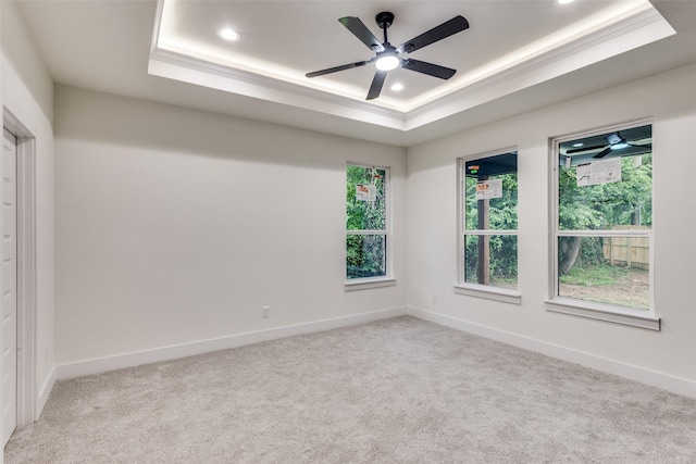 2614 Ave G, Fort Worth, TX 76105 - carpeted empty room with a raised ceiling, recessed lighting, a ceiling fan, baseboards, and crown molding