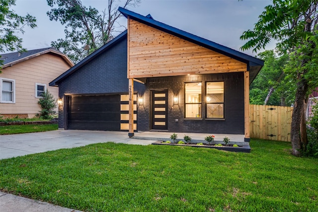 2614 Ave G, Fort Worth, TX 76105 - contemporary home featuring driveway, a garage, and brick siding