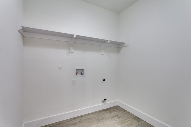 2614 Ave G, Fort Worth, TX 76105 - washroom with light wood-type flooring, baseboards, hookup for a gas dryer, hookup for a washing machine, and electric dryer hookup