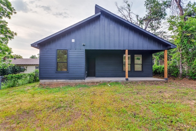 2614 Ave G, Fort Worth, TX 76105 - rear view of house featuring covered porch and board and batten siding