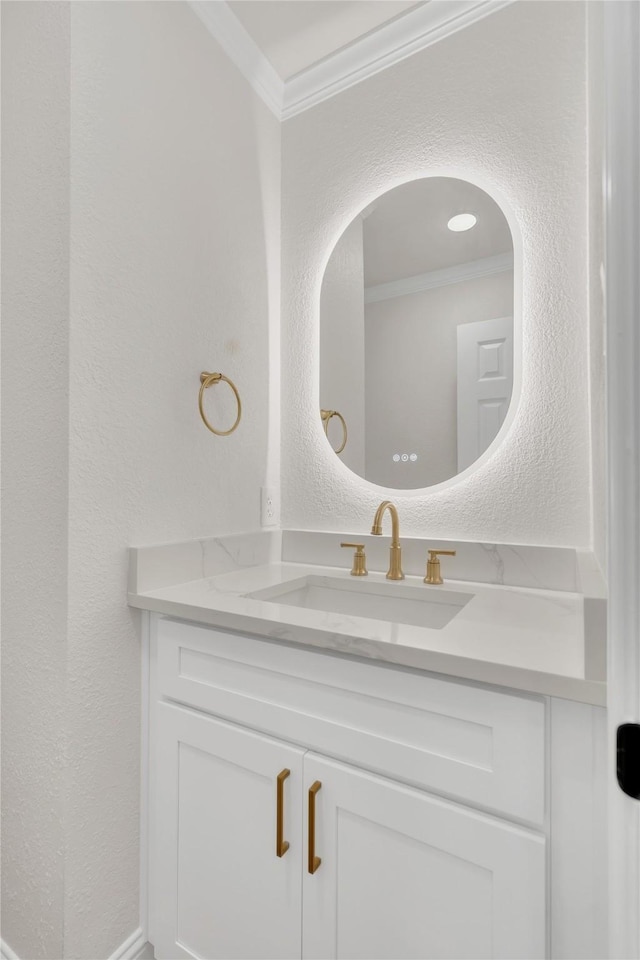 1529 Harvest Run Dr, Allen, TX 75002 - bathroom featuring crown molding, vanity, and a textured wall