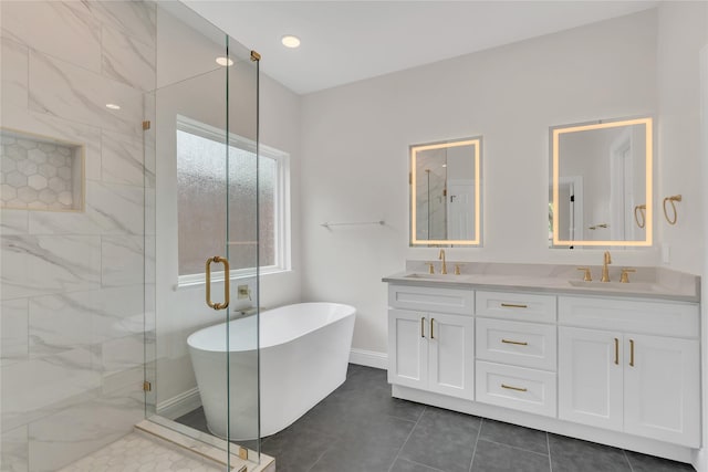 1529 Harvest Run Dr, Allen, TX 75002 - full bath featuring a shower stall, a freestanding bath, double vanity, baseboards, and tile patterned floors