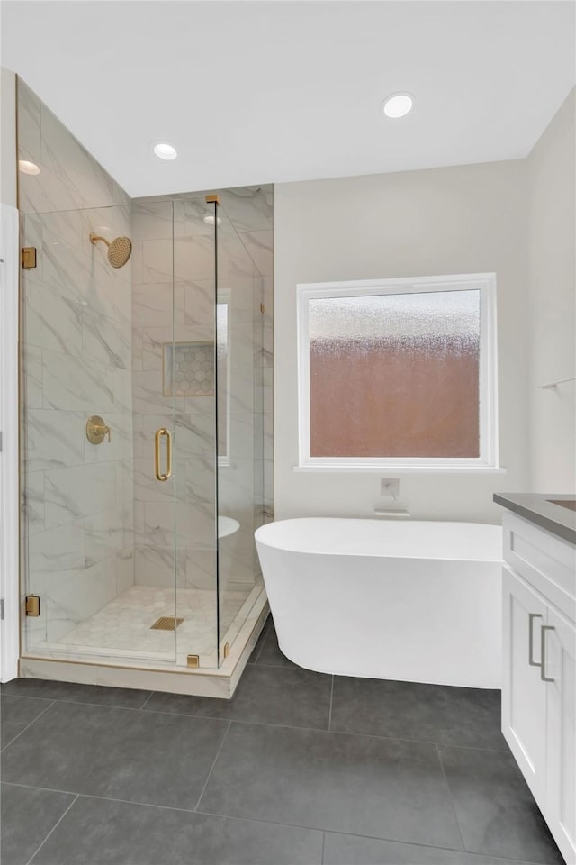 1529 Harvest Run Dr, Allen, TX 75002 - full bath with a soaking tub, a stall shower, tile patterned floors, vanity, and recessed lighting