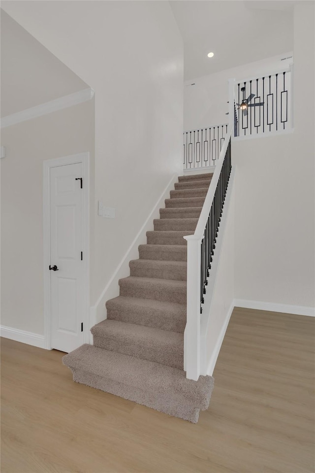 1529 Harvest Run Dr, Allen, TX 75002 - stairway with wood finished floors, baseboards, recessed lighting, and crown molding