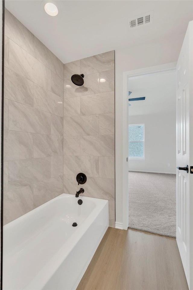 1529 Harvest Run Dr, Allen, TX 75002 - bathroom featuring shower / washtub combination and wood finished floors