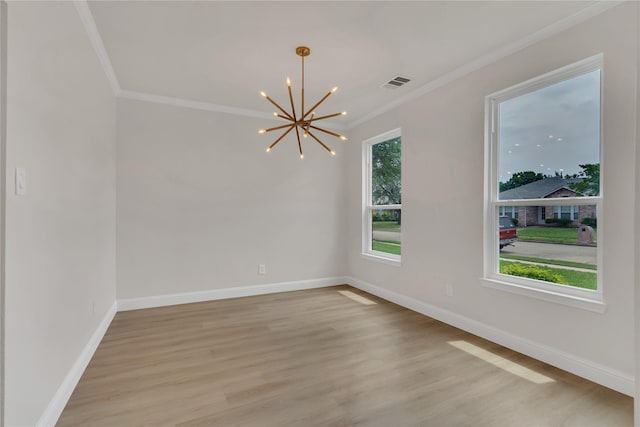 1529 Harvest Run Dr, Allen, TX 75002 - empty room featuring a chandelier, crown molding, light wood-type flooring, and baseboards