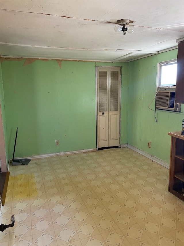 303 Pecan St, Bardwell, TX 75101 - spare room with light floors, cooling unit, and baseboards