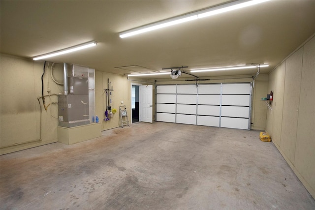 1413 Oak Hills Dr, Graham, TX 76450 - garage featuring a garage door opener and heating unit