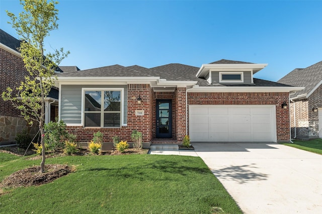 7111 Manhattan Dr, Rowlett, TX 75088 - view of front of home with a garage, concrete driveway, a front lawn, brick siding, and a shingled roof