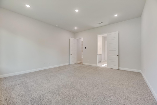 7111 Manhattan Dr, Rowlett, TX 75088 - empty room featuring light colored carpet, recessed lighting, and baseboards