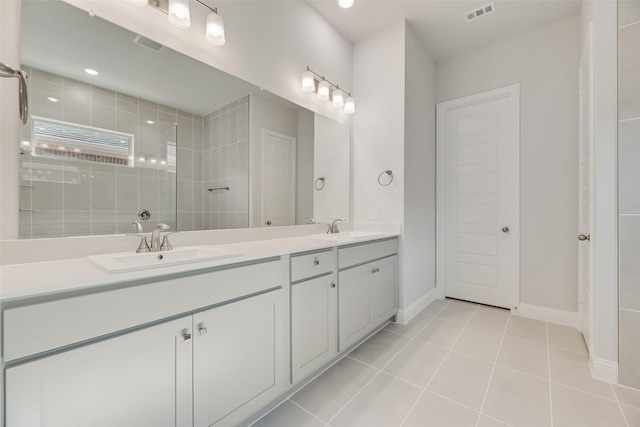 7111 Manhattan Dr, Rowlett, TX 75088 - full bath with tile patterned flooring, walk in shower, baseboards, and double vanity