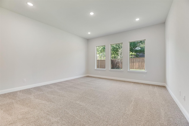 7111 Manhattan Dr, Rowlett, TX 75088 - spare room featuring recessed lighting, light carpet, and baseboards