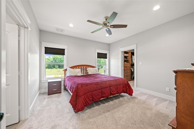 12570 County Road 313, Tyler, TX 75708 - carpeted bedroom featuring baseboards, a walk in closet, recessed lighting, a ceiling fan, and a closet