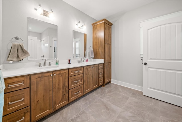 12570 County Road 313, Tyler, TX 75708 - full bath with marble look tile flooring, double vanity, and baseboards