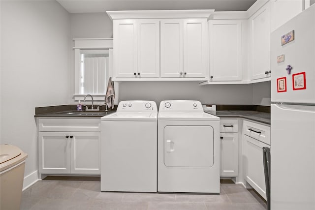 12570 County Road 313, Tyler, TX 75708 - clothes washing area featuring washing machine and dryer and light tile patterned floors
