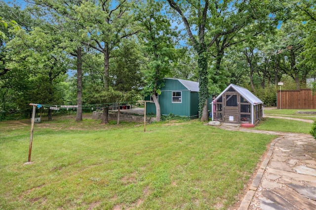 635 Old Justin Rd, Argyle, TX 76226 - view of yard with exterior structure, an outbuilding, and view of wooded area